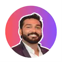 a man with a beard is smiling in front of a purple and red circle