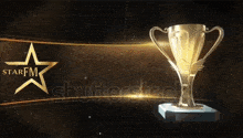 a gold trophy with a starfm logo on the bottom