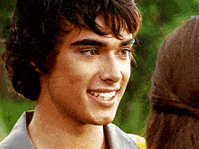 a close up of a man 's face smiling