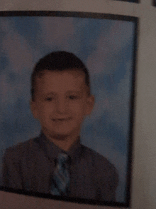 a picture of a young boy in a tie