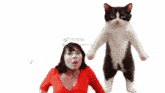 a woman in a red shirt stands next to a black and white cat that says " hadir untuk silatur "