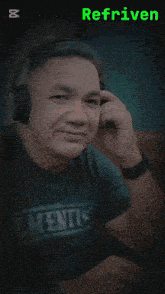 a man wearing headphones and a shirt which says elements