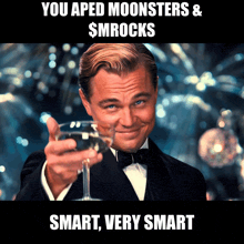 a man in a tuxedo is holding a glass of wine with the caption " you aped moonsters & $mrocks " above him