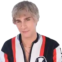 a young man with blonde hair is wearing a striped jacket