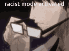 a man wearing glasses with the words racist mode activated on the bottom