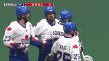 a group of lacrosse players are celebrating a goal by schreib