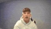 a blurry picture of a person with a hoodie that says a on it