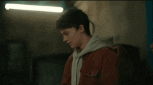 a blurred image of a man with a tabii logo on the bottom right