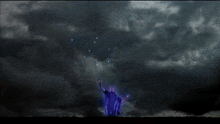 a blue lightning bolt strikes a person in the dark