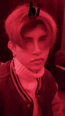 a man in a red jacket and white turtleneck with the word hi above him