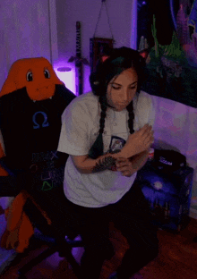 a woman in a senpai shirt is dancing in a room