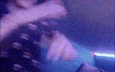 a blurry picture of a person 's face in a dark room