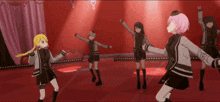 a group of anime girls are dancing on a red stage