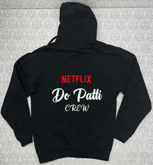 a black hoodie says netflix do patti crew