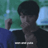 a man in a purple shirt is pointing at another man with the caption wen and yuta