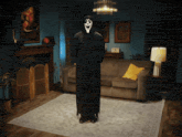a person dressed as a grim reaper in a living room