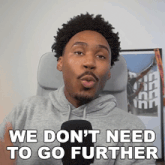 a man in a grey hoodie says we don t need to go further