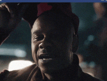 a man wearing a red hat that says ' america ' on it