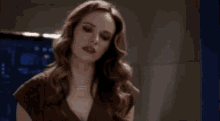 a woman is saying let 's fuck while standing in a dark room .