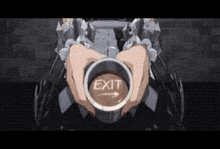 a person is holding a cup of coffee with a button that says `` exit '' .