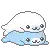 two seals are laying on top of each other on a white background .