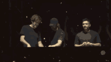 three men are standing in front of a screen that says hello to you