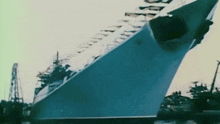a large ship is docked in a harbor and has the word russia on the side