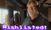 a man wearing headphones and glasses says " wishlisted "