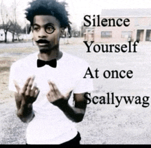 a man wearing glasses and a bow tie has the words silence yourself at once scallywag written above him