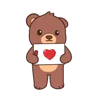 a brown teddy bear is holding a sign with a heart on it