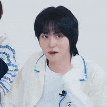 a close up of a person 's face with a name tag that says ' 박주원 ' on it