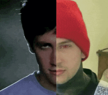 a man wearing a red beanie and a black shirt