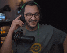 a man wearing headphones and a shirt that says that 's all folks