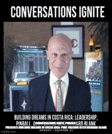 a man in a suit and tie with the words conversations ignite