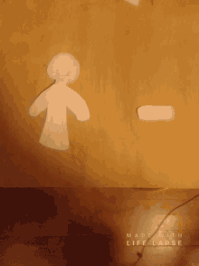 a paper cut out of a person with the words made with life lapse on the bottom right