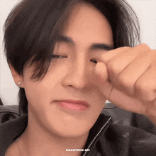a close up of a person 's face with the words heartchu.gif below