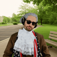 a man wearing a wig and sunglasses is sitting on a park bench