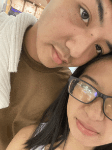 a man and a woman are posing for a picture in front of a burger king restaurant