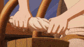 a person is holding a cloth in their hands while sitting on a chair