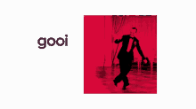 a man in a suit and tie is holding a cane with the words gooi de swung erin behind him