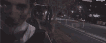 a blurry photo of a man walking down a street