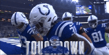 the indianapolis colts are celebrating a touchdown against the washington redskins