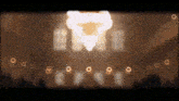 a blurred image of a building with a few lights on