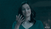 a woman with a ring on her finger and a netflix logo