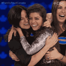 Friends Hugging Family Feud Canada GIF - Friends Hugging Family Feud Canada Happy GIFs