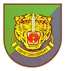 a tiger with a sword in its mouth and the words " cepat dan cergas " below it