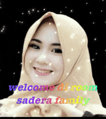a woman wearing a hijab with the words welcome di room sadera family behind her