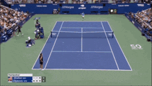 a tennis player is wearing a blue and white shirt with a lacoste logo
