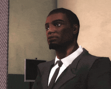 a man in a suit and tie is standing in a corner