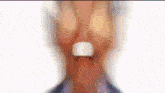a close up of a man 's face with his mouth open and his eyes closed